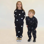 Load image into Gallery viewer, Brunette the Label Oversized Kids All Over Heart Oversized Jogger - Black

