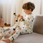 Load image into Gallery viewer, Roobear Holiday Trucks Two-Piece Pajamas
