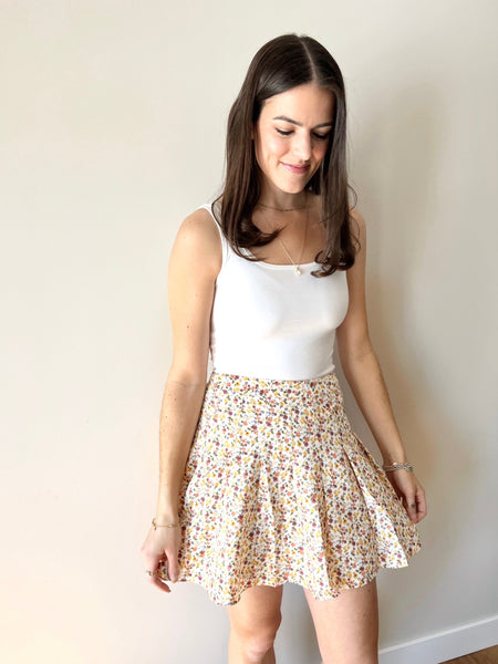 Floral mini skirt best sale 7 little words